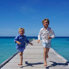 Boys swim trunks : PINEAPPLE - OLIVE children running down the pontoon Mustique