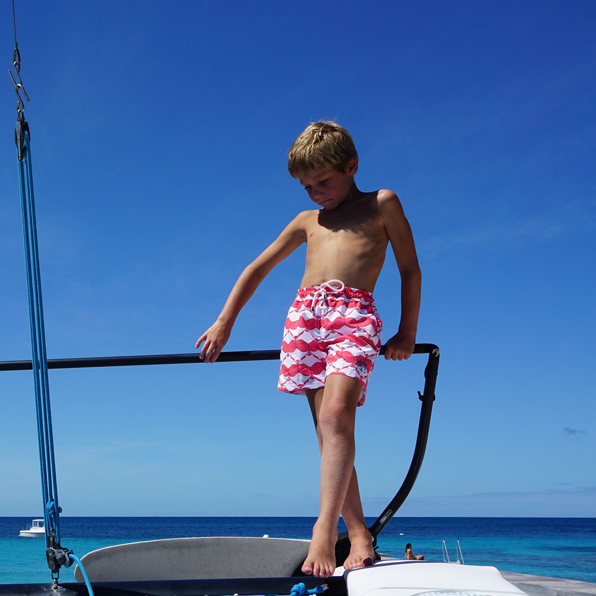 Boys swim trunks : MANTA RAY - RED on the dock Mustique