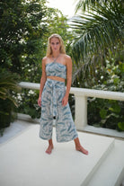 Luxury silk vacation style Gabija palazzo pants in monochrome whale print with matching shirred bandeau top by designer Lotty B Mustique