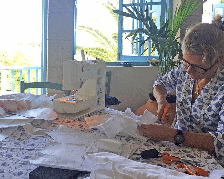 Lotty pattern cutting and sewing Pink House "toile" samples for new telier collections for the Mustique boutique