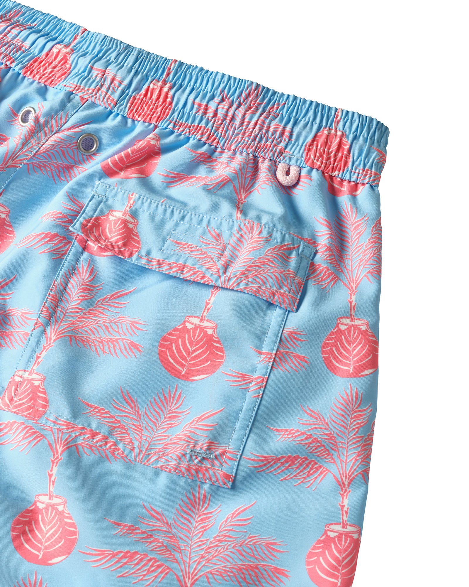 Back pocket detail of Mens recycled swim shorts in Potted Palm coral turquoise by Pink House Mustique