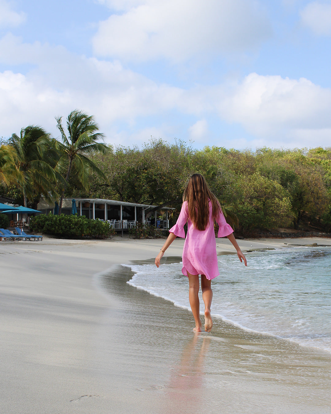 Women's beach resort style by Lotty B for Pink House, Decima dress in Fuchsia pink by Cotton House beach bar, Mustique Island