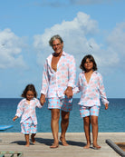 Beach vacation essentials for all the family recycled swim shorts in Potted Palm coral turquoise by Pink House Mustique