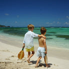 Boys swim trunks : BANANA TREE - PALE BLUE vacation kids styles, designer Lotty B for Pink House Mustique