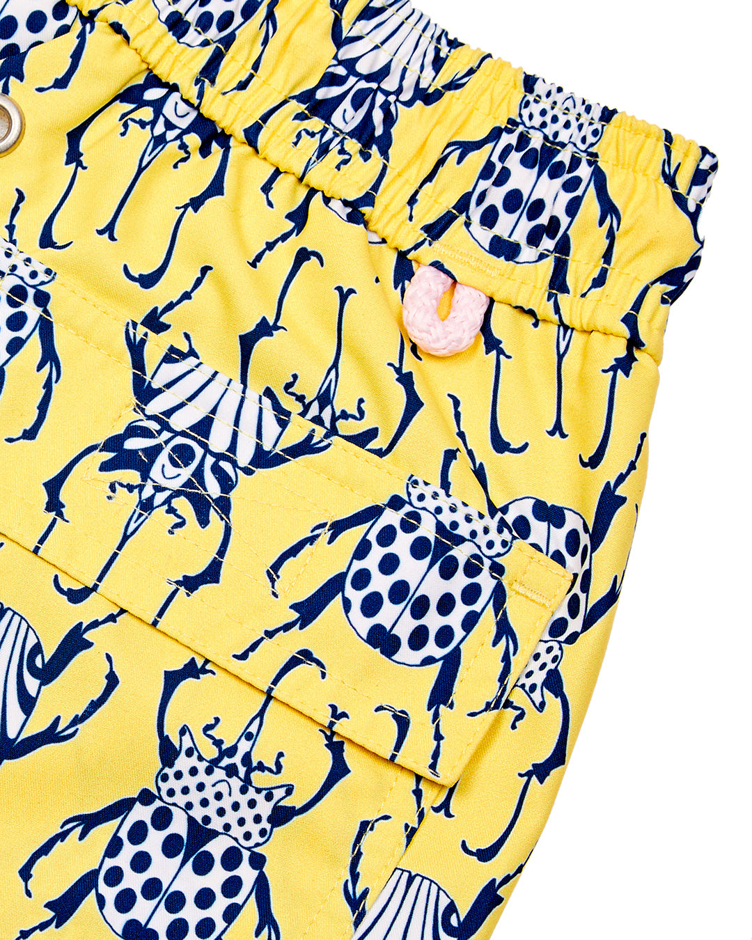 Back pocket and waistband detail for kids swim shorts in yellow and navy Beetle print by Lotty B for Pink House