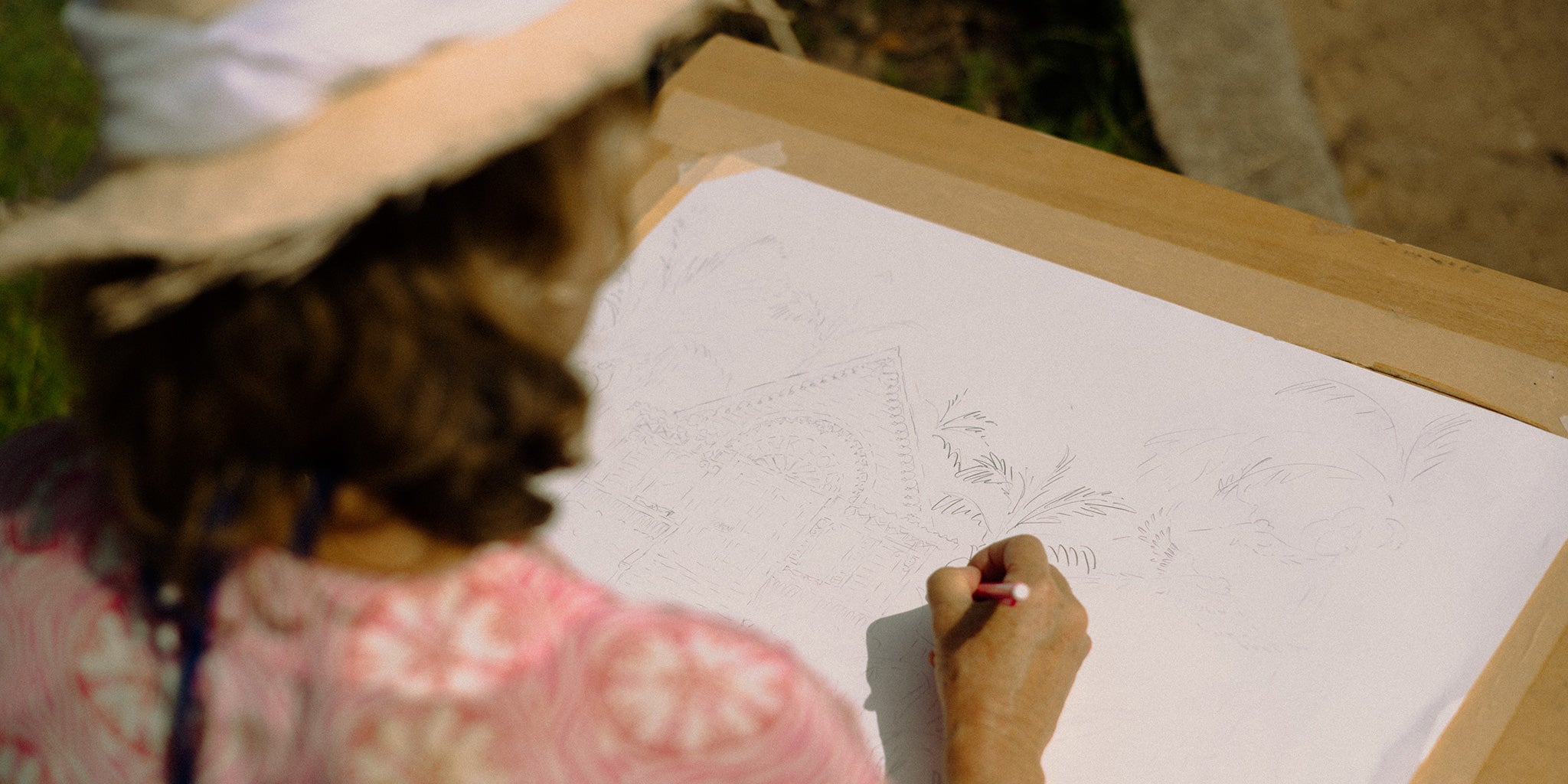 British designer Lotty B sketches designs at her home on Mustique Island in the West Indies. 