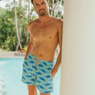 Swim shorts built to last in green & blue Egret bird print by Lotty B Mustique