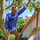 Tree climbing on vacation dazzling blue linen shirt by Lotty B Mustique