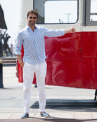 Thumbs up for classic white linen trousers paired with blue shelltop linen shirt by Pink House