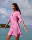 Island vacation style by Lotty B for Pink House Decima dress in Fuchsia pink on the Cotton House pier, Mustique Island