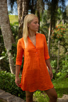 Luxury vacation women's Decima dress in orange pure linen by Lotty B Mustique resortwear