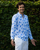 Men's classic white vacation linen pants styled with blue pomegranate linen shirt by Pink House