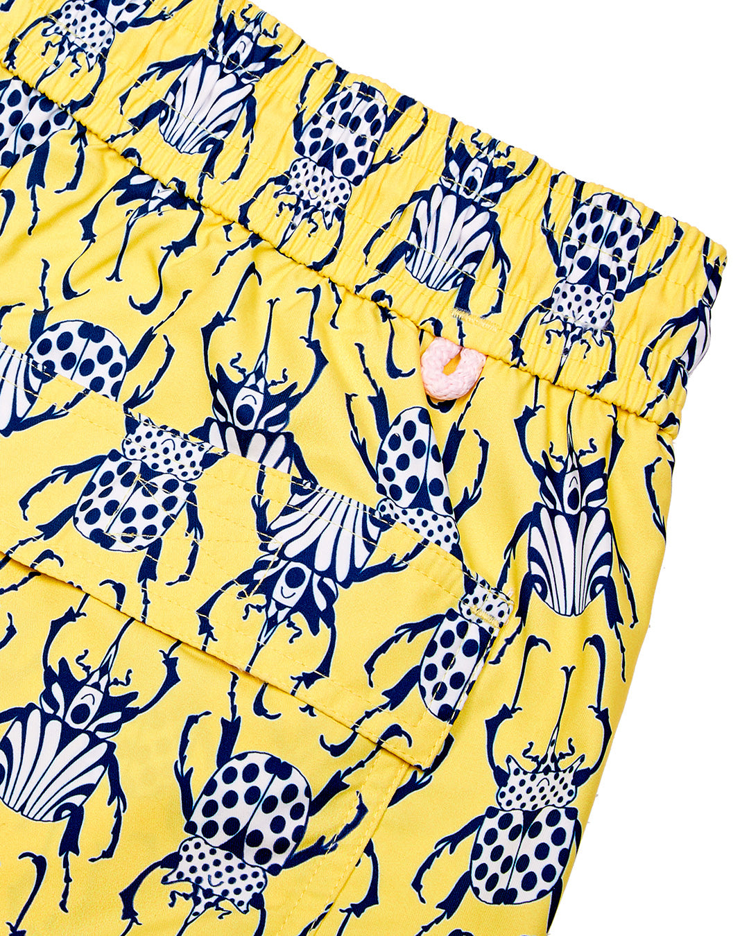 Back pocket and waistband detail for men's swim shorts in yellow and navy Beetle print by Lotty B for Pink House