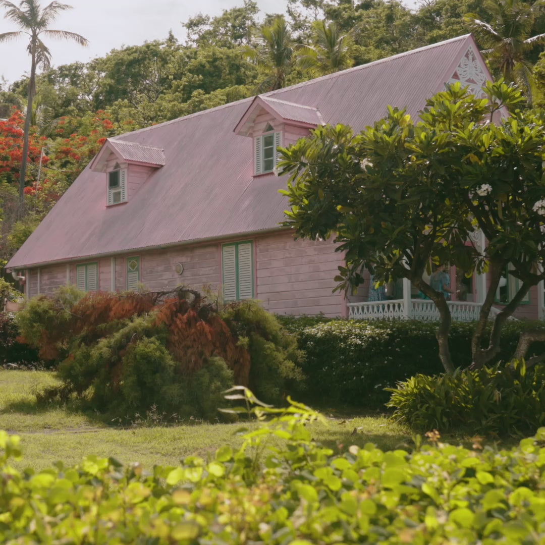 The iconic gingerbread-style boutique shop nestled beneath the palms on the Caribbean island of Mustique.