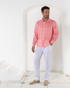 Men's vacation style white linen pants worn with striped shell pink print shirt by Pink House resortwear