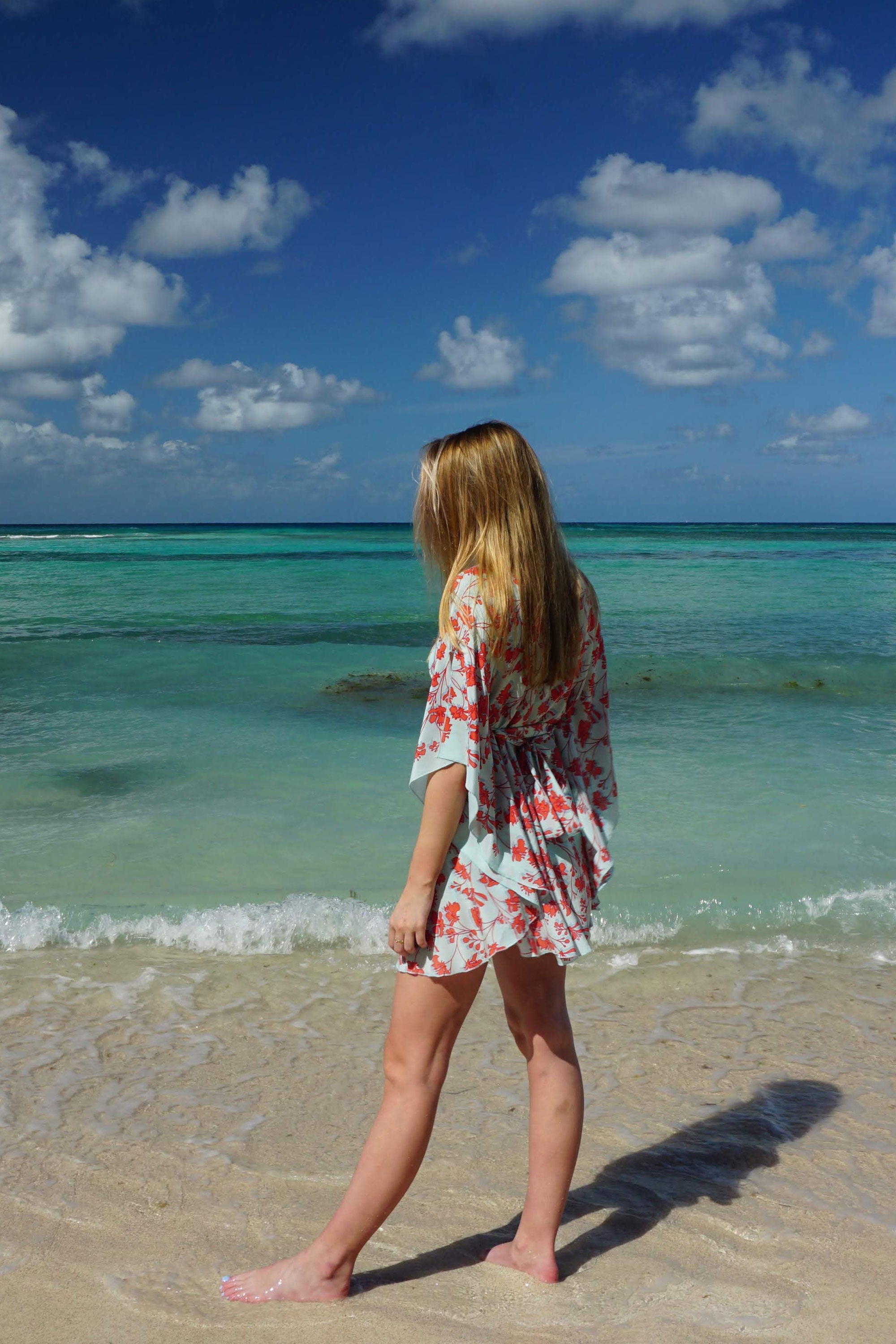 Silk Lotty Kaftan: FLAMBOYANT FLOWER - ORANGE short collared crepe de chine kaftan created by Lotty B Mustique holiday clothing