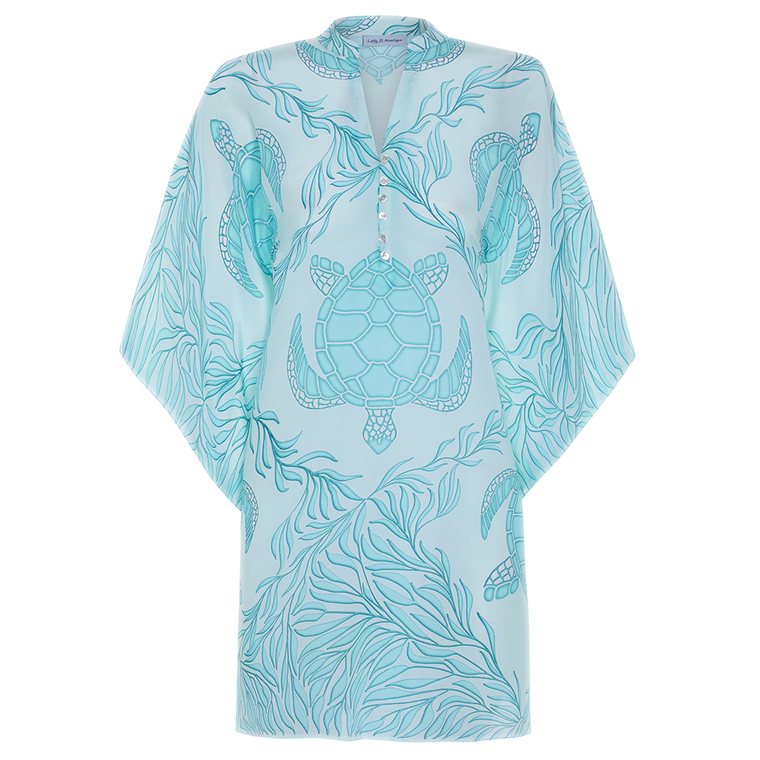 This season's Mustique must-have - The "Lotty" kaftan features a short Nehru-style collar and deep V neckline fastened with an elegant line of 6 mother of pearl buttons.