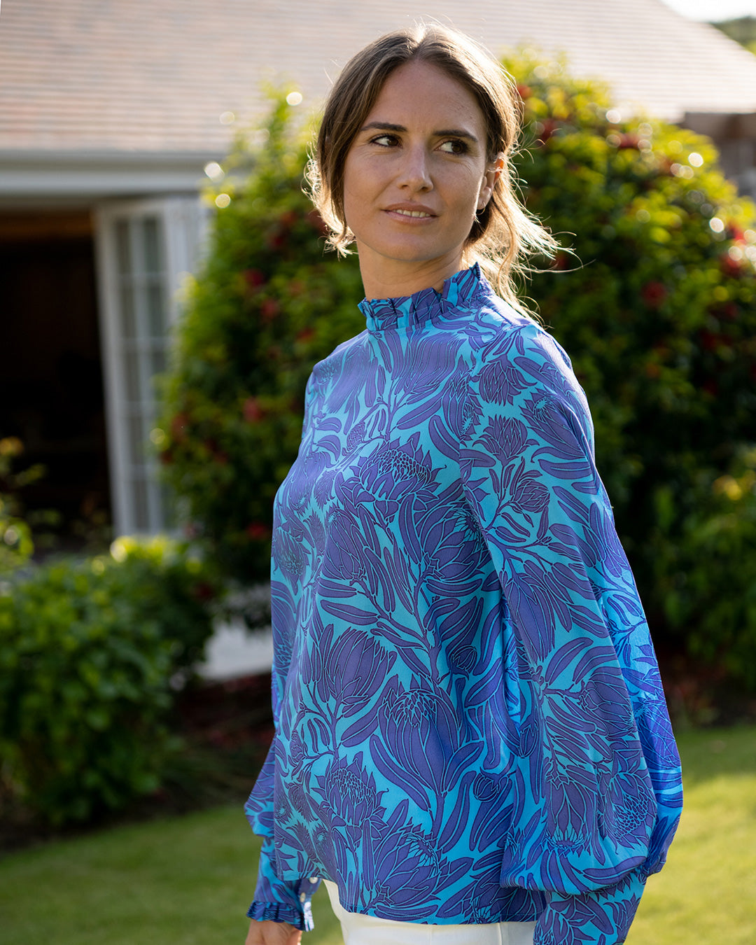 Silk cocktail blouse in violet & turquoise protea flower print by Lotty B