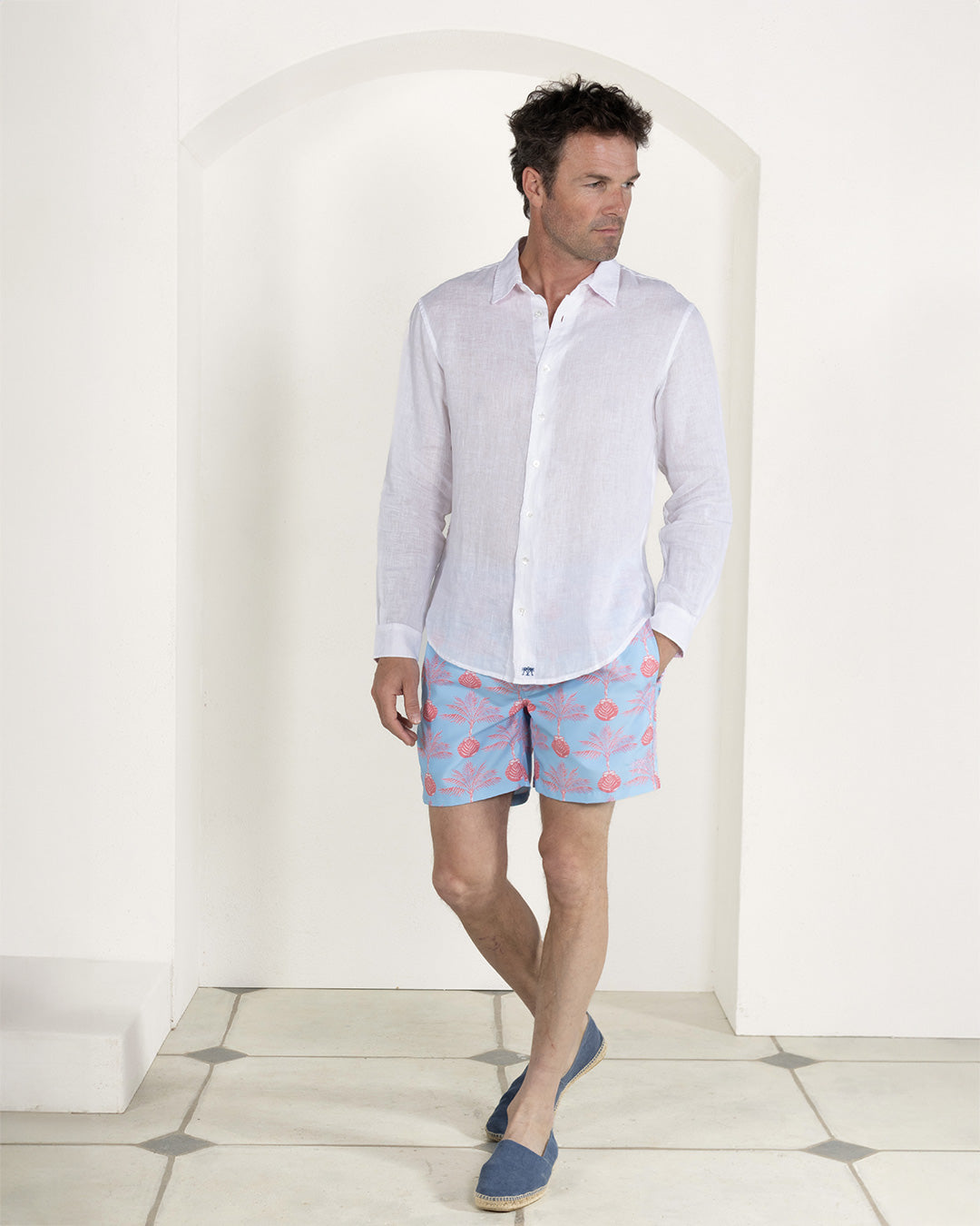 Stylish mens vacation essentials recycled swim shorts in Potted Palm coral turquoise by Pink House Mustique