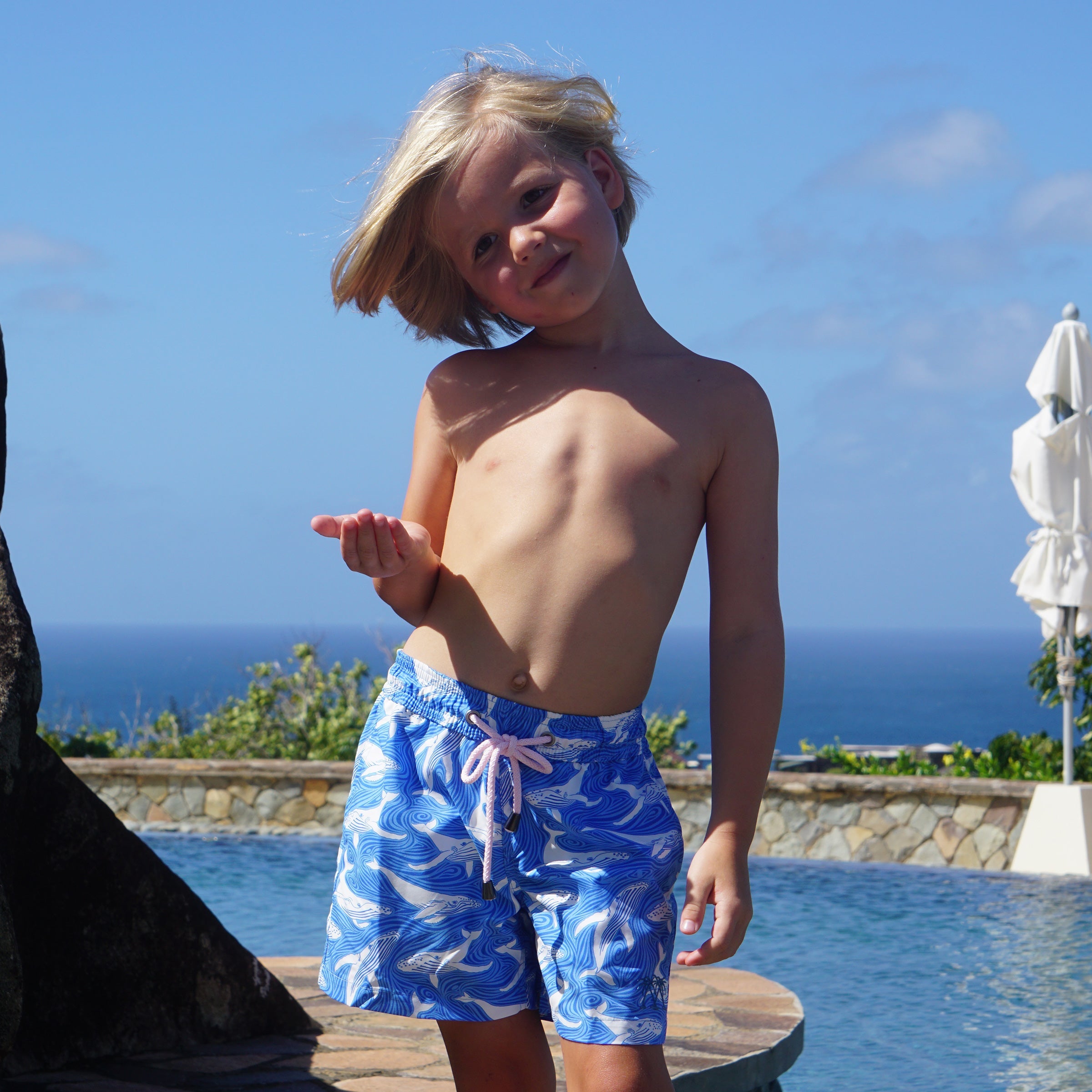 Boys swim shorts animal print whales blue by designer Lotty B Mustique holiday style